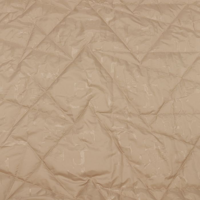 Ткань курточная стеганая шир.140см, цв.бежевый с надписями стежка треугольники 
